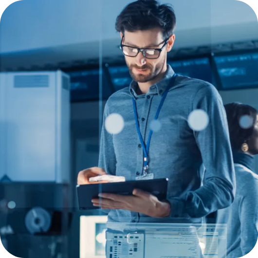 Developer working on a tablet in a tech environment