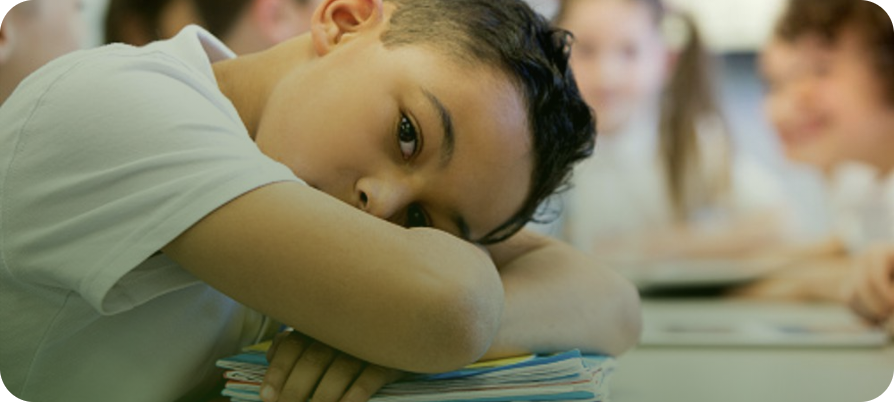 Child looking bored while studying